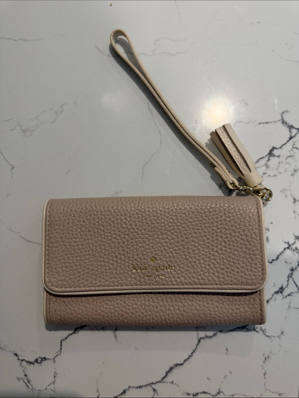 kate spade pebbled leather wristlet in taupe beige with tassel